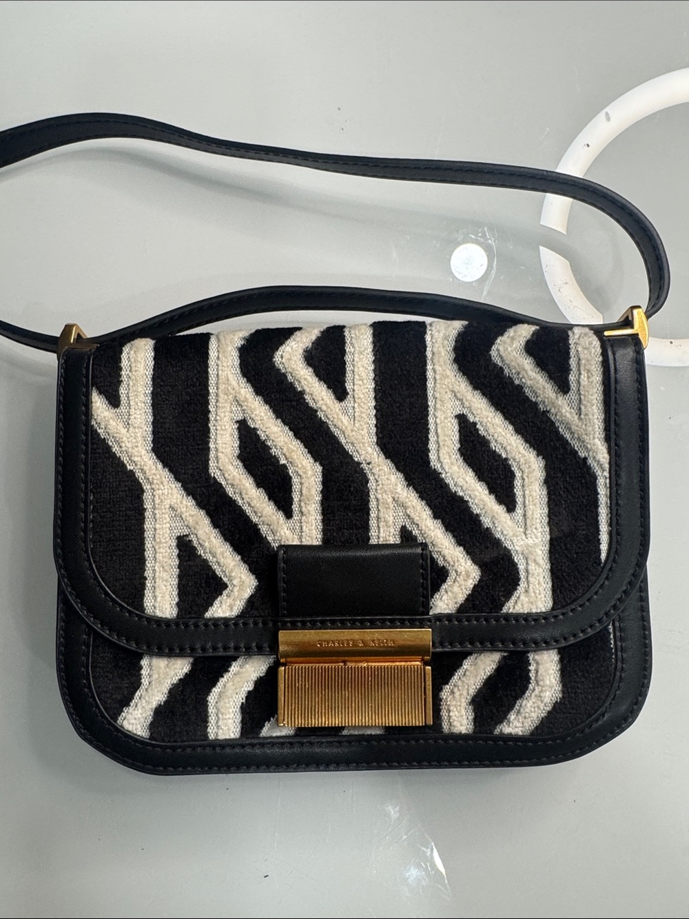 Charles & Keith Black and White Geometric Crossbody with Gold Hardware